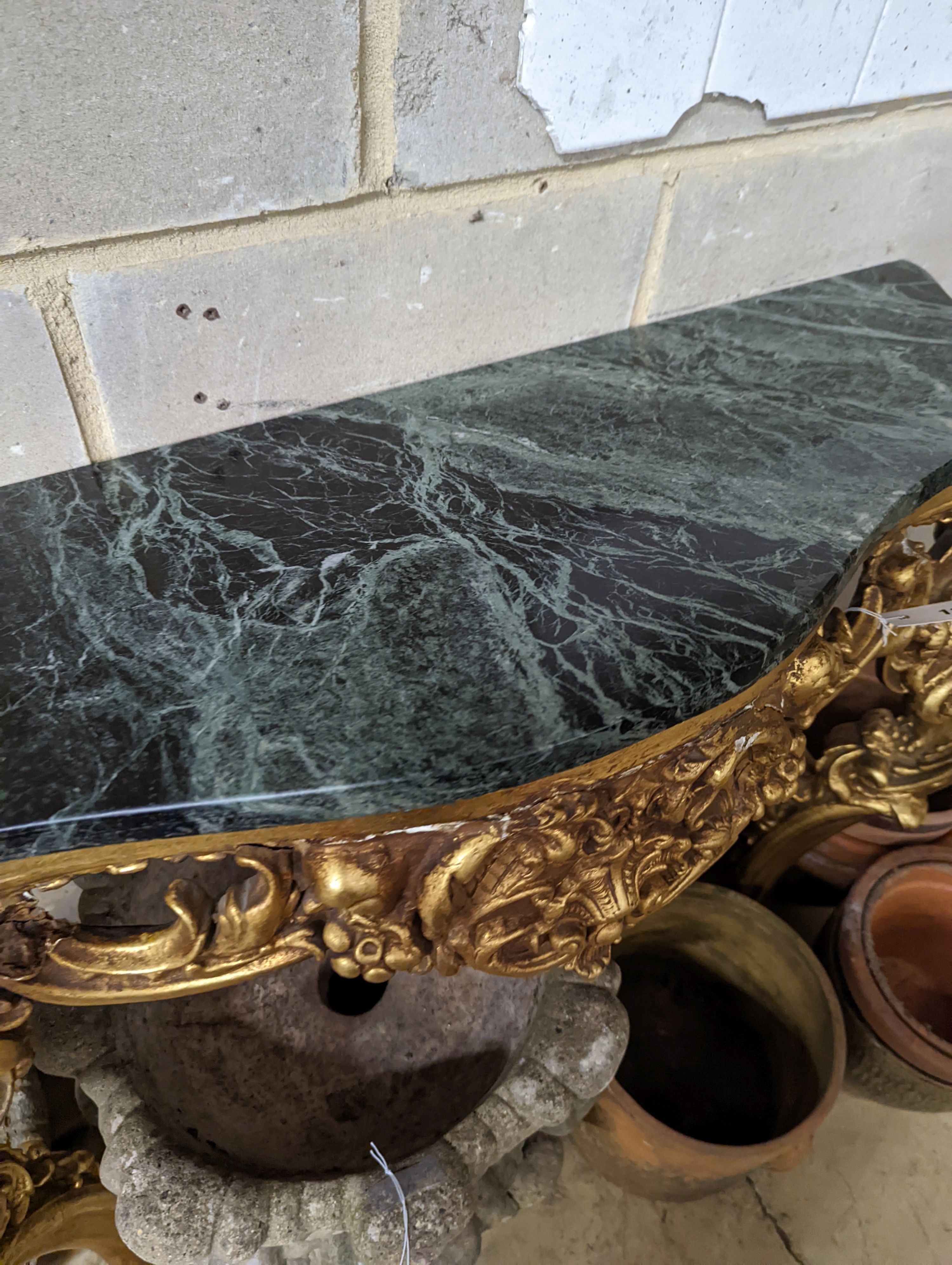An 18th century style serpentine giltwood marble top console table, width 123cm, height 87cm